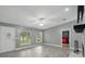 Inviting living room with modern flooring, multiple windows, and a partial view of the bedroom at 2950 Ragis Rd, Edgewater, FL 32132