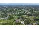 Stunning aerial view of the community, showcasing its golf course, lush landscapes, and beautiful homes at 3 Pine Meadow Ct, Debary, FL 32713