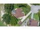 Aerial view of a home with a screened-in pool, manicured landscaping, and a circular driveway at 3 Pine Meadow Ct, Debary, FL 32713
