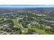 Panoramic aerial view showcasing the community, golf course, and surrounding lakes, ideal for relaxed living at 3 Pine Meadow Ct, Debary, FL 32713