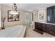 A well-lit bathroom with a soaking tub, a dark wood vanity, and a large mirror above the sink at 3 Pine Meadow Ct, Debary, FL 32713