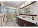 Modern bathroom featuring a glass shower, dual vanity, and elegant tile flooring at 3 Pine Meadow Ct, Debary, FL 32713