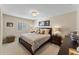 Cozy bedroom with neutral tones, comfortable bed, and stylish furnishings creates a relaxing retreat at 3 Pine Meadow Ct, Debary, FL 32713