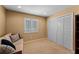 Neutral bedroom with a large window and a closet with folding doors at 3 Pine Meadow Ct, Debary, FL 32713