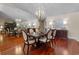 Elegant dining room featuring hardwood floors and a hanging chandelier at 3 Pine Meadow Ct, Debary, FL 32713