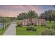 Beautiful home with lush landscaping, a long driveway, and a detached garage at 3 Pine Meadow Ct, Debary, FL 32713