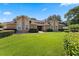 Charming home with a well-manicured lawn, inviting entrance, and lush bushes at 3 Pine Meadow Ct, Debary, FL 32713