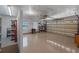 Spacious garage featuring epoxy flooring, ample storage, and a ceiling fan for added comfort at 3 Pine Meadow Ct, Debary, FL 32713