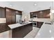 Modern kitchen featuring stainless steel appliances, a kitchen island, and white countertops at 3 Pine Meadow Ct, Debary, FL 32713