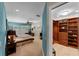 Main bedroom with a walk-in closet, fan, and light coming in from the windows at 3 Pine Meadow Ct, Debary, FL 32713