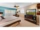 Spacious main bedroom with a ceiling fan, neutral walls, and a large window that provides plenty of light at 3 Pine Meadow Ct, Debary, FL 32713