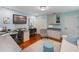 Bright home office with hardwood floors, built-in shelving, and a desk area at 3 Pine Meadow Ct, Debary, FL 32713