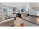Bright office space with built-in shelving, stylish furniture, and wood floors at 3 Pine Meadow Ct, Debary, FL 32713