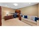 Spacious home office with custom desk, sofa, and neutral carpeting at 3 Pine Meadow Ct, Debary, FL 32713
