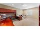 Spacious office with built-in desk, shelving, a comfortable seating area, and carpet at 3 Pine Meadow Ct, Debary, FL 32713