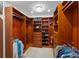 Spacious walk-in closet with custom shelving, hanging rods, and ample storage space at 3 Pine Meadow Ct, Debary, FL 32713