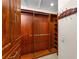 Spacious walk-in closet with wooden shelving, hanging rods and ample storage space at 3 Pine Meadow Ct, Debary, FL 32713