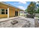 Wonderful backyard featuring a brick paver patio with pond, waterfall, and fire pit at 31 Abacus Ave, Ormond Beach, FL 32174