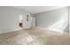 Spacious carpeted bedroom with gray walls, decorative accents, and doorway to adjoining bathroom at 31 Abacus Ave, Ormond Beach, FL 32174