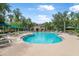 Inviting community pool with lounge chairs, tables, and umbrellas, perfect for relaxation at 31 Abacus Ave, Ormond Beach, FL 32174