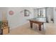 Spacious game room featuring a ping pong table and workout equipment with neutral colored walls at 31 Abacus Ave, Ormond Beach, FL 32174
