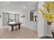 Spacious game room featuring a ping pong table, a view into a wine rack and neutral colored walls at 31 Abacus Ave, Ormond Beach, FL 32174