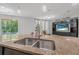 Open kitchen featuring a large island, granite countertops, and stainless steel appliances at 31 Abacus Ave, Ormond Beach, FL 32174