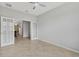 Bright and airy living room featuring french doors and open access to another room with chandelier at 31 Abacus Ave, Ormond Beach, FL 32174