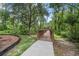 Wooden walking bridge in a natural wooded area perfect for community recreation at 31 Abacus Ave, Ormond Beach, FL 32174