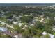 An aerial view of a residential neighborhood with mature trees and well-maintained homes at 3117 Pine Tree Dr, Edgewater, FL 32141