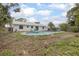 Backyard with pool and treed perimeter at 3117 Pine Tree Dr, Edgewater, FL 32141