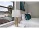 Comfortable bedroom featuring view of a pool, creating a serene retreat at 3117 Pine Tree Dr, Edgewater, FL 32141