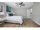 Inviting bedroom with a fan, ensuite bath, and natural light, ideal for relaxation at 3117 Pine Tree Dr, Edgewater, FL 32141