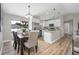 Bright dining area connecting to a modern kitchen, creating an inviting space at 3117 Pine Tree Dr, Edgewater, FL 32141