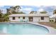 Back of house with a pool and outdoor seating area at 3117 Pine Tree Dr, Edgewater, FL 32141