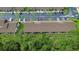 Aerial of condo complex with parking and palm trees, showcasing the property's layout and setting at 325 Homewood Ave # 10I, Debary, FL 32713