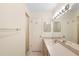 Bathroom featuring a shower and a vanity sink with lots of lights and counter space at 325 Homewood Ave # 10I, Debary, FL 32713