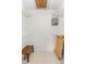 Walk-in closet featuring tiled floors, a wooden bench, and wire shelving for optimal storage at 325 Homewood Ave # 10I, Debary, FL 32713