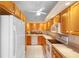 The bright kitchen offers lots of cabinet space, modern white appliances, and backyard views at 325 Homewood Ave # 10I, Debary, FL 32713