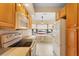 A bright kitchen features modern appliances and a breakfast nook overlooking the landscaped front yard at 325 Homewood Ave # 10I, Debary, FL 32713
