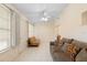 Comfortable living room with tile floors, ceiling fan, and seating, perfect for relaxing and entertaining at 325 Homewood Ave # 10I, Debary, FL 32713