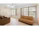 Bright living room with tile flooring, a large closet, and natural light from the windows and door at 325 Homewood Ave # 10I, Debary, FL 32713