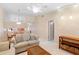 Inviting living room with neutral tile, ceiling fan, comfortable seating, and open layout at 325 Homewood Ave # 10I, Debary, FL 32713
