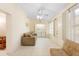 Cozy sunroom featuring tile floors, a ceiling fan, and a laundry area with a washer and dryer at 325 Homewood Ave # 10I, Debary, FL 32713