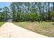 Exterior view of a manicured lawn with rock water feature and faux deer statues at 3428 Longleaf Rd, Ormond Beach, FL 32174