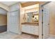 Spacious bathroom featuring a vanity, a closet, and access to additional rooms at 3428 Longleaf Rd, Ormond Beach, FL 32174