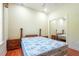 This bedroom features a mirrored closet, a ceiling fan, and two night stands at 3428 Longleaf Rd, Ormond Beach, FL 32174