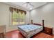 This bedroom features a large window, two night stands, and curtains at 3428 Longleaf Rd, Ormond Beach, FL 32174
