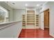 This bonus room has a decorative light, built-in shelving, and a sliding-door entrance at 3428 Longleaf Rd, Ormond Beach, FL 32174