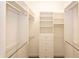 Walk-in closet with custom shelving, drawers, and ample storage space at 3428 Longleaf Rd, Ormond Beach, FL 32174